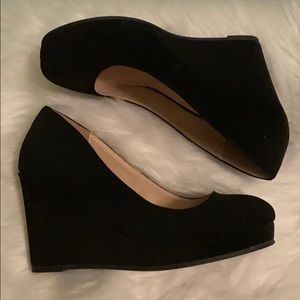 Never worn wedge heels, black in color, size 7.5